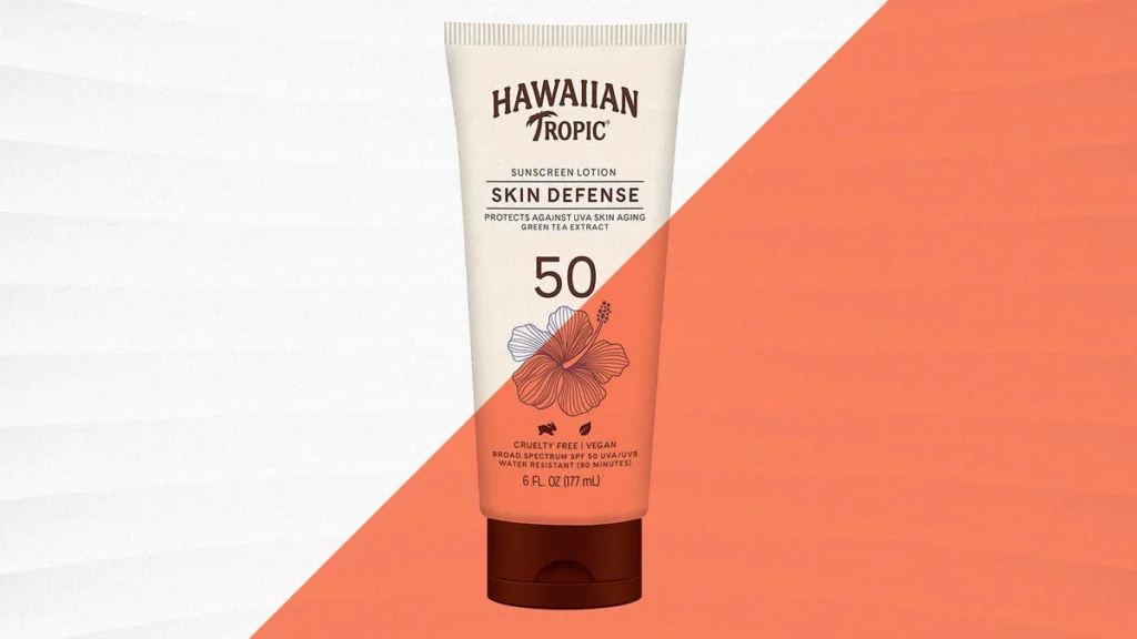 Next-Gen SPF: 7 Proven Benefits for Superior Tropical Skin Protection in 2026 6 Tube of Hawaiian Tropic Skin Defense SPF 50 sunscreen lotion with green tea extract on a white and orange background.