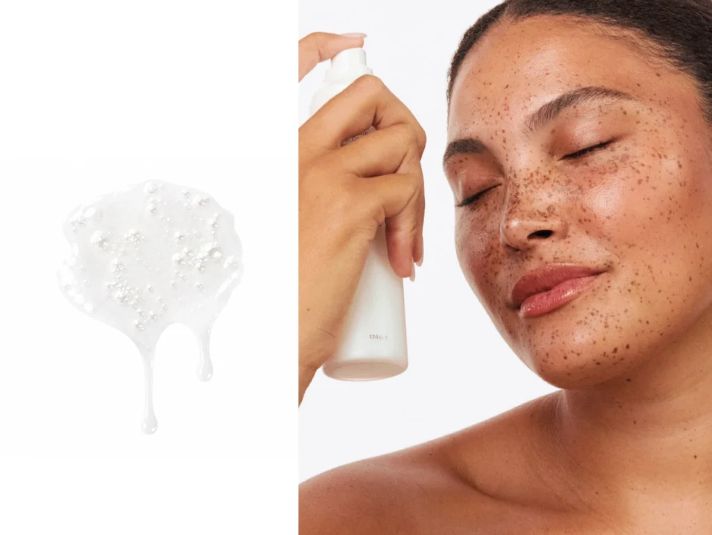 Probiotic Cosmetics: 7 Proven Benefits for a Superior Skin Microbiome 3 Hand holding a white bottle of Calming Probiotic Skin Mylk Rescue Mist by esmi Skin with a clear liquid drop sample shown.